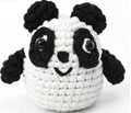 Handmade chubby black and white panda crochet stuffed animal toy, perfect as a cute desk pet or soft plush gift.
