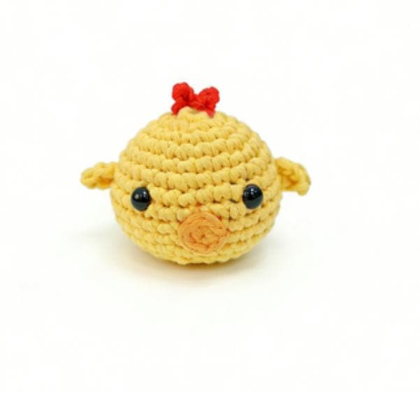 Cute yellow baby chick crochet amigurumi plushie with a red crest