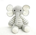 Handmade cute grey and white elephant crochet stuffed animal. A kawaii amigurumi plushie featuring a striped body, large floppy ears, and a long trunk, perfect as neutral nursery decor, a desk pet, or a finished handmade gift.